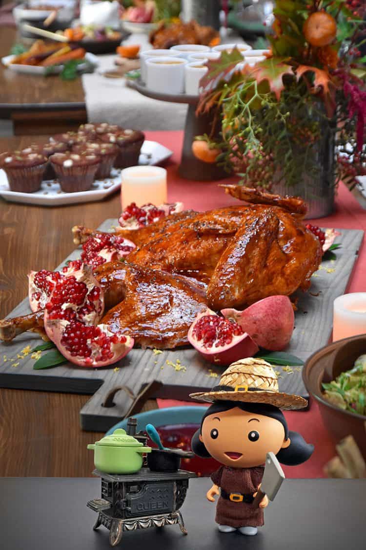 A shot of a Paleo Thanksgiving table with a spatchcock turkey and all the side dishes.