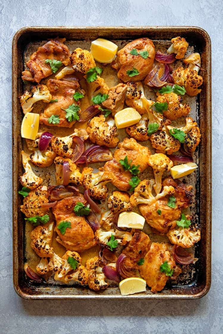 An overhead shot of healthy and easy sheet pan Chicken tandoori, a Whole30 and keto-friendly dinner!