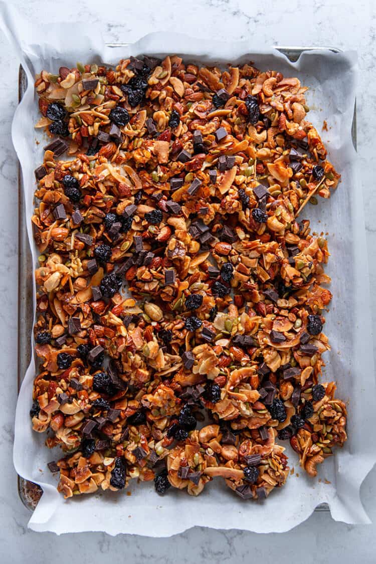 An overhead shot of a tray of chocolate cherry paleo granola, a tasty homemade holiday edible gift