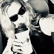 Excited and happy female customer with her custom printed Cafepress travel mug.