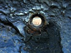 wall metal hole round peep small opening black