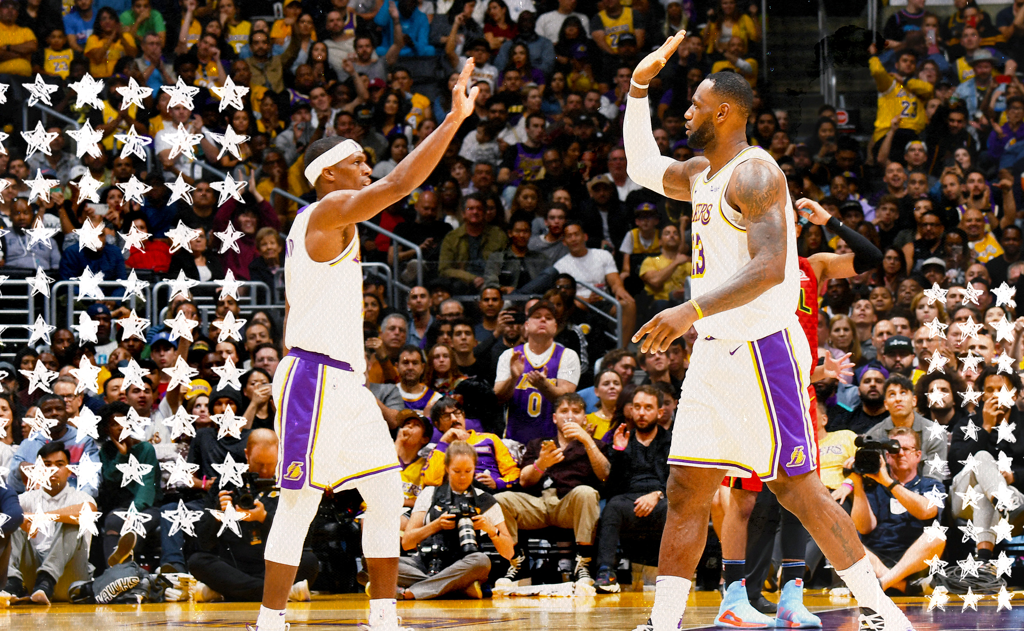 LeBron James and Rajon Rondo high-five each other.