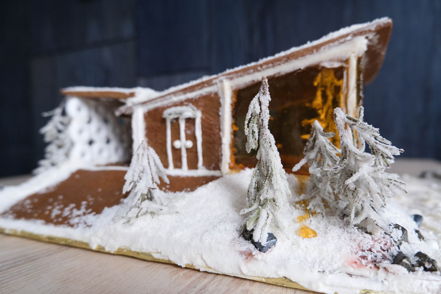 Midcentury modern gingerbread house with slanted roof.