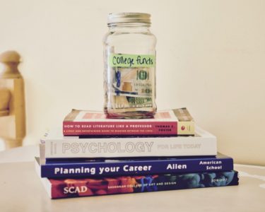 text books and savings jar