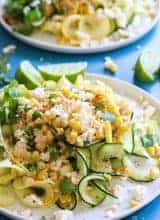 Mexican Street Corn Zucchini Pasta! &nbsp;Fresh corn loaded up with lime juice, queso, and chili powder on top of summer zucchini and squash. &nbsp;The perfect light and easy dish for hot summer days!