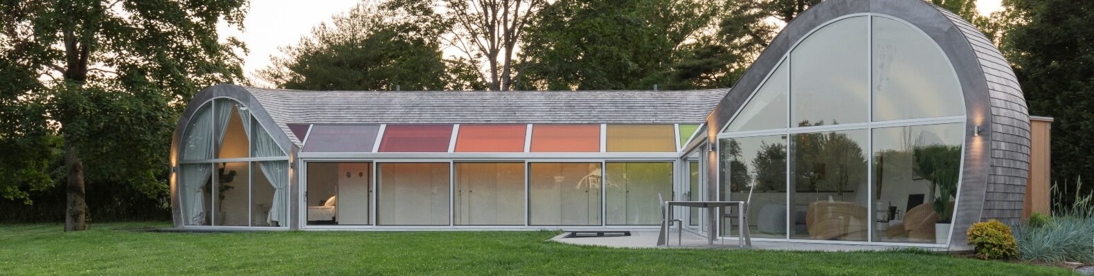 curved home with multicolored skylights