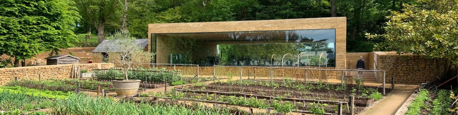 horizontal building with large window looking out over garden