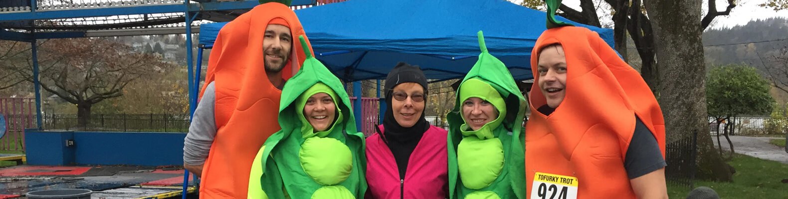 runners wearing carrot and pea costumes
