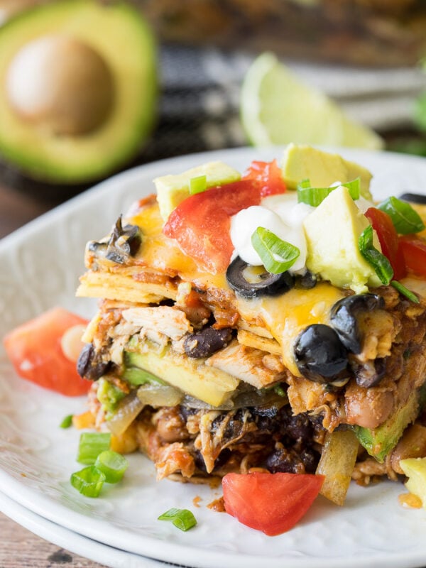 This super EASY Chicken Enchilada Casserole Recipe is a long time family favorite! It combines great flavors into a no-fuss dinner!