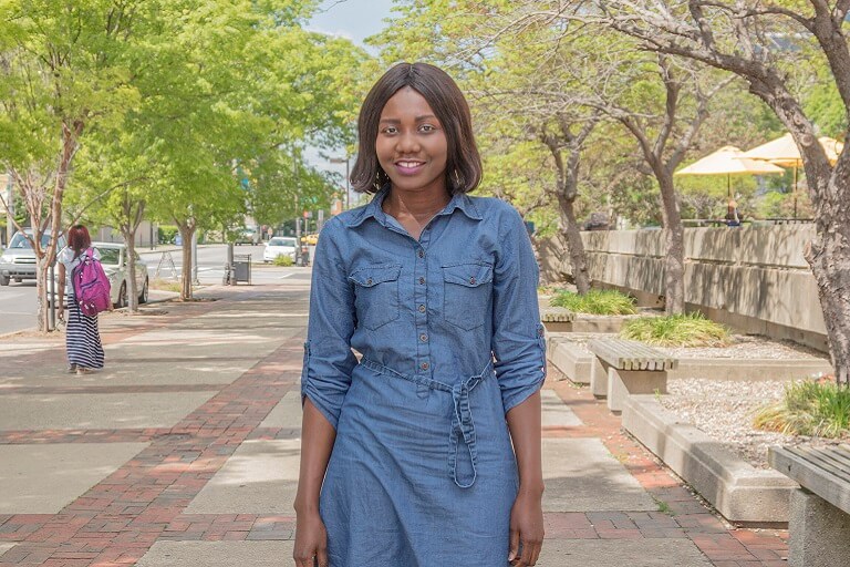 diverse students male and female talking around a table