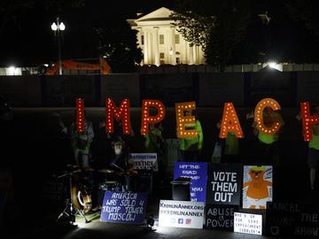 Protesters with 'Kremlin Annex' call to impeach President Donald Trump in Lafayette Square Park in front of the White House in Washington, Tuesday, Sept. 24, 2019.