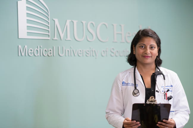 Dr. Kristen Hood-Watson talking with patient