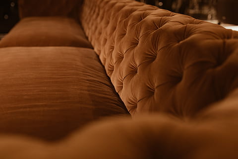 orange velvet couch, sofa, furniture, home, modern, luxury, couch, cushions, cosy, cozy, expensive, velvet, indoors, selective focus, brown, food and drink, no people, comfortable, food, domestic room, close-up, relaxation, wealth, in a row, absence, dark, arts culture and entertainment, temptation, still life, softness, leather, 5K, CC0, public domain, royalty free