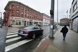A stretch of storefronts in April 2019 on Wall Street in Norwalk, Conn. At year end, the city unveiled a new program of grants to underwrite the cost of facade improvements for stores throughout Norwalk.