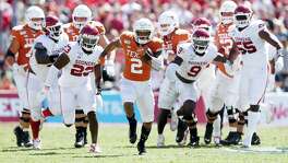 Texas&rsquo; Roschon Johnson (2) runs up the field for a big play as the Oklahoma defense gives chase during the second half in the Red River Showdown at the Cotton Bowl in Dallas on Saturday, Oct. 12, 2019. Oklahoma won, 34-27.