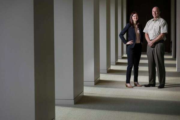 Robert Burke, right, with his pro bono lawyer Emma Doineau, who is an associate at Locke Lord, at the law firm's downtown office Doineau helped Burke get his life back after he had problems with the IRS. For a period of time, he was living in his truck, which he said flooded during Hurricane Harvey. "I was kind of glad that part of my life was gone," he said of the truck.