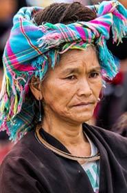 Tam Duong, North Vietnam - October 18, 2012: Portrait of a woman from the Red Hmong mountain tribe on the traditional market of Tam Duong.