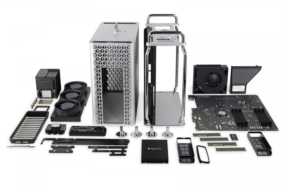 The individual components of a 2019 Mac Pro computer laid out on a table.