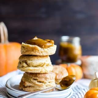 Pumpkin Butter slathered on three biscuits with cute little pumpkins around