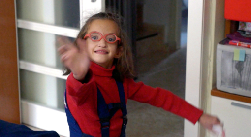 Emily waving at the camera