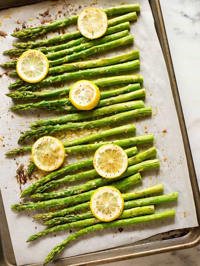 Overhead View of Entire Sheet Pan with Asparagus topped with Parmesan Cheese After Roasting