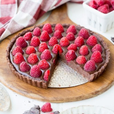 This&nbsp;No-Bake Raspberry Chocolate Tart&nbsp;comes together in just ten minutes! The no-bake chocolate crust is filled with vegan chocolate ganache and topped with fresh raspberries for a decadent, guilt-free treat.
