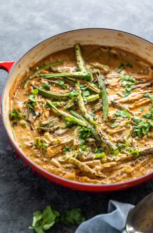 okra curry served in a red pan