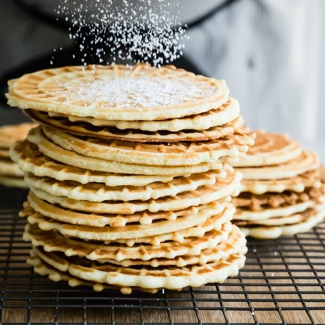 An easy Pizzelle recipe for the classic Italian cookie. Lightly sweetened and flavored with vanilla or anise, they are perfect for holiday gift-giving!