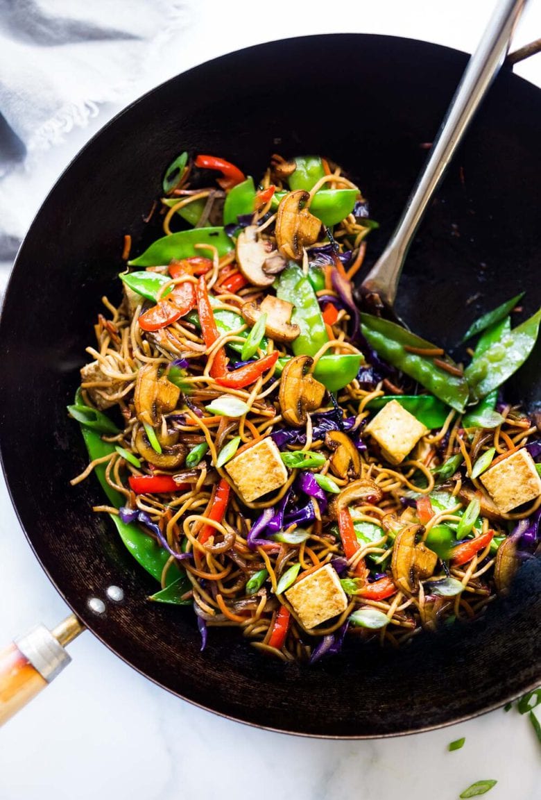 Veggie Lo Mein! On the table in under 20 minutes! Loaded up with healthy veggies, this VEGAN dinner recipe is fast and easy, perfect for busy weeknights! #lomein #lomeinnoodles #vegandinner #veganrecipes #veganlomein #stirfry