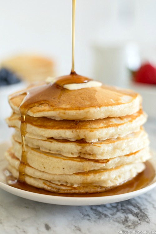 the best ever homemade pancakes on a plate with a drizzle of maple syrup cascading down the side