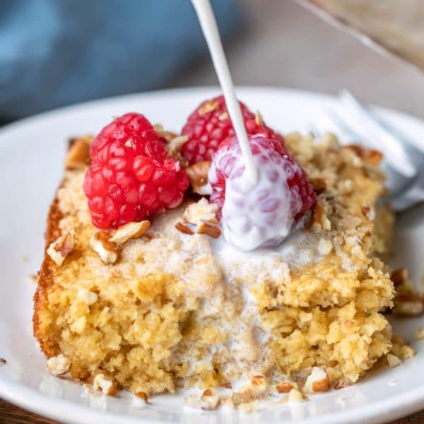 Milk pouring onto a piece of baked oatmeal