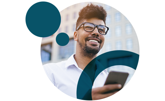 man smiling and using phone