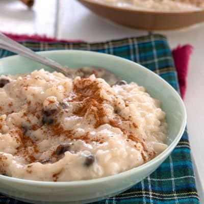 Small bowl of arroz con dulce garnished with cinnamon