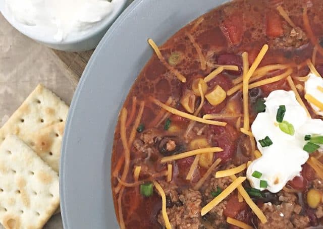 close up of the cheese on top of soup