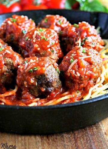 pan with gluten-free meatballs on top of spaghetti topped tomato sauce