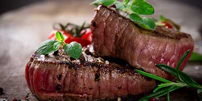 Charbroiled steak with garnish