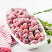 Whether you call them sugared cranberries or candied cranberries, they're the perfect sparkling garnish to nearly any holiday dish or cocktail. They're great on their own, too!