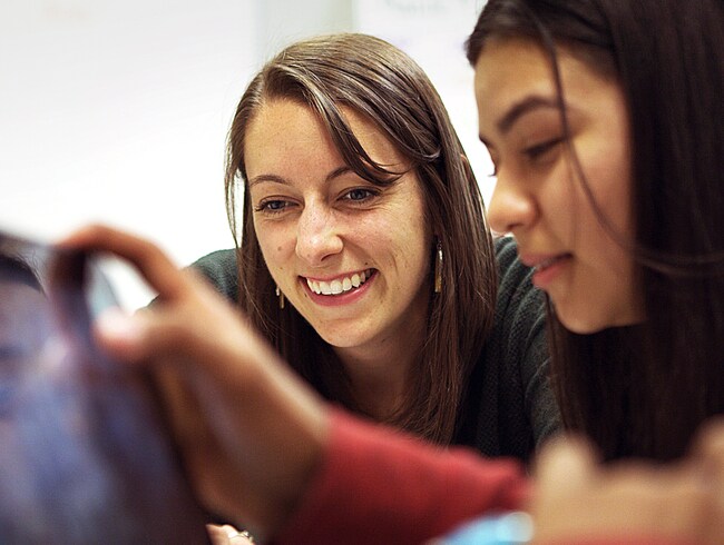 teacher working with a student